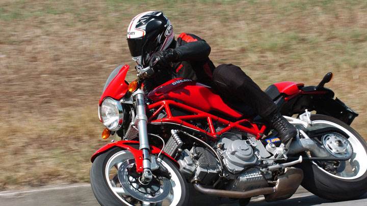 Ducati Monster S2r-1000 2005 in Red Ridind on Race Track